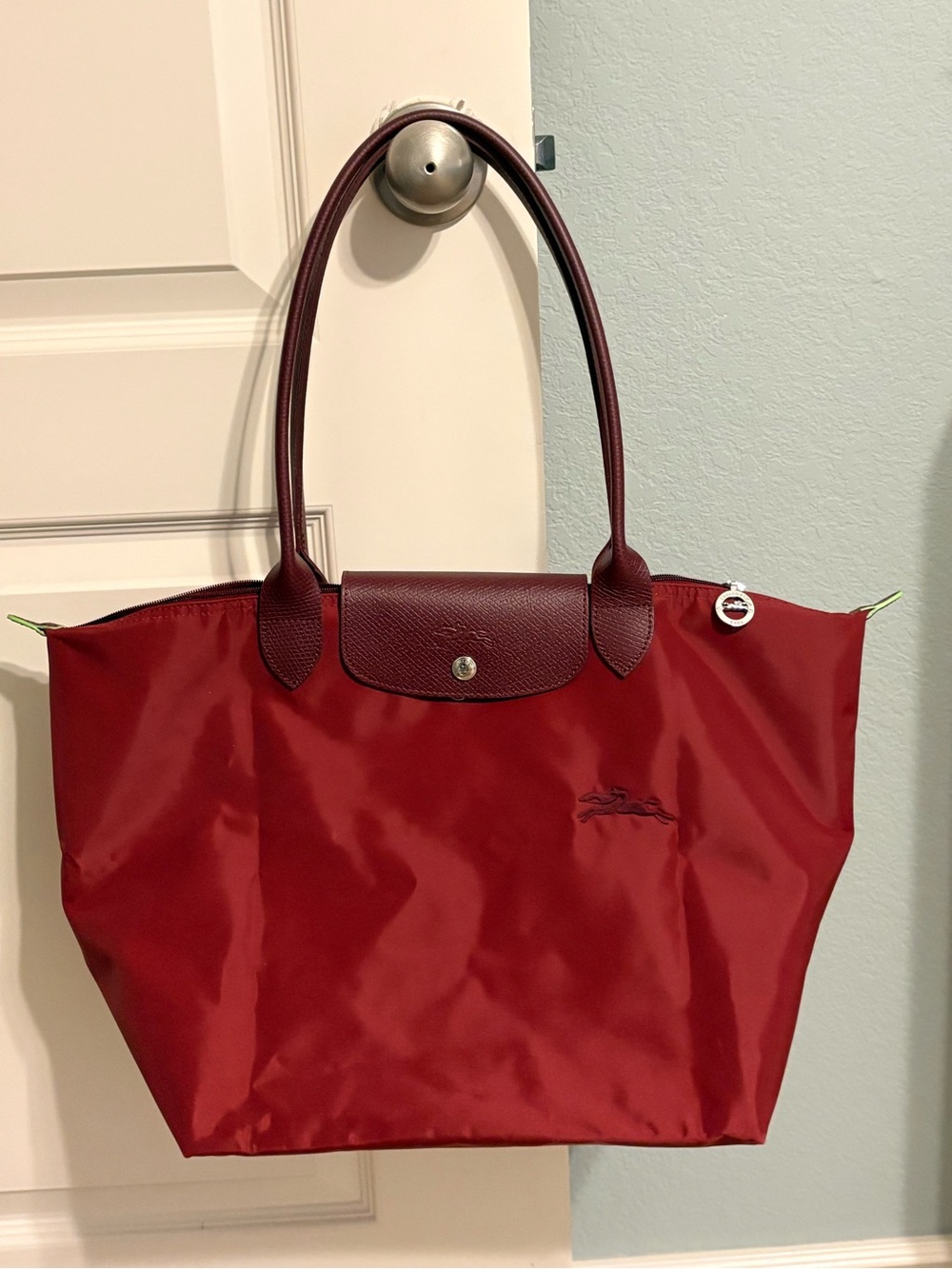 Longchamp le pliage large Pomengranate color canvas Tote with Leather Trim